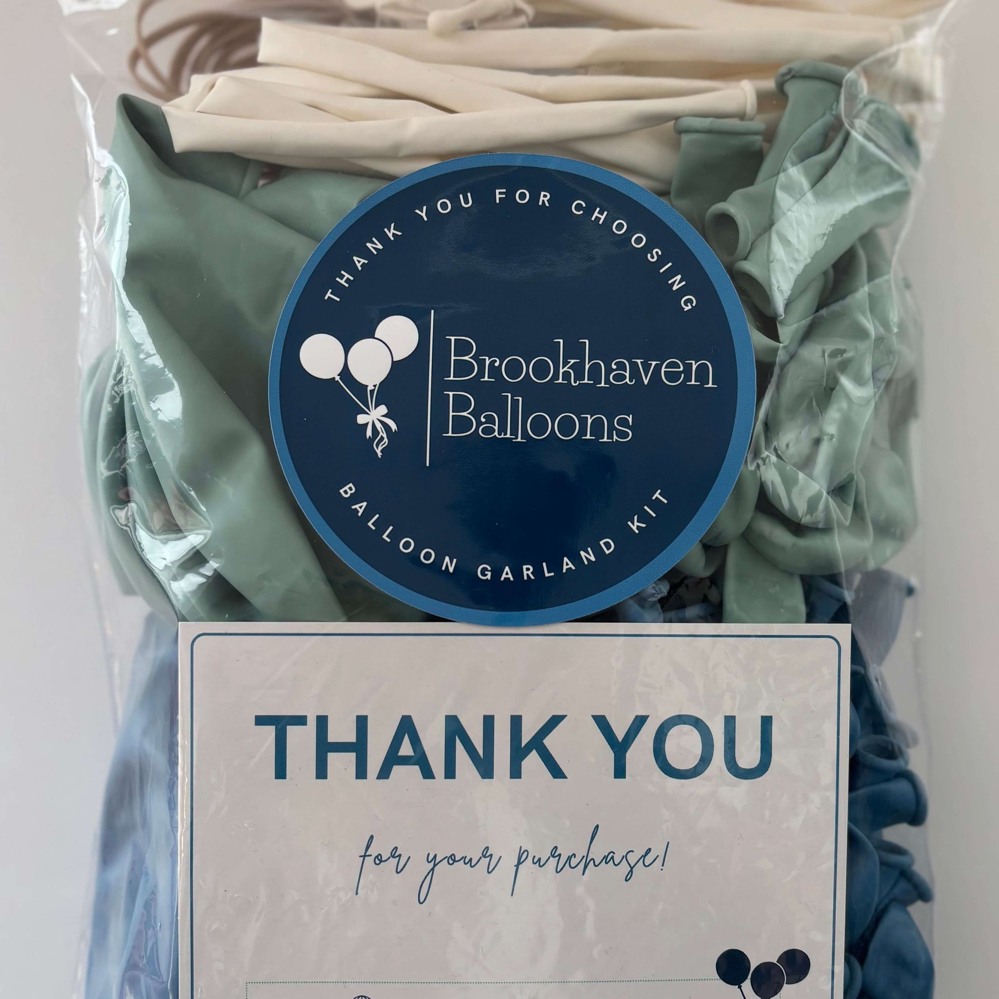 Balloon garland kit by Brookhaven Balloons featuring various colors and a thank you note for your purchase.